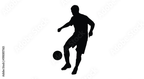 Silhouette of a soccer player kicking a ball in dynamic motion