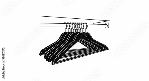 A row of black clothes hangers hangs from a rod