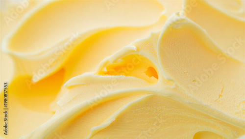 Tableau sur toile Close up macro texture of swirled yellow butter or cream with food photography b