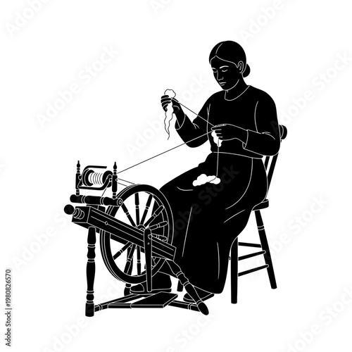 A woman sits operating a spinning wheel