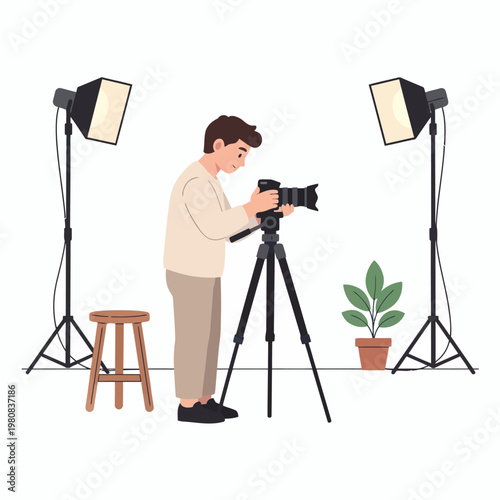 A man using a camera on a tripod, studio setup with lights