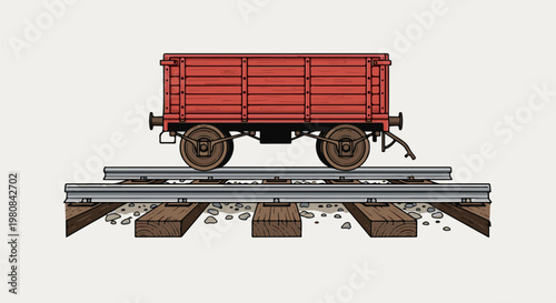A vintage red freight car rests on a railway track with wooden sleepers