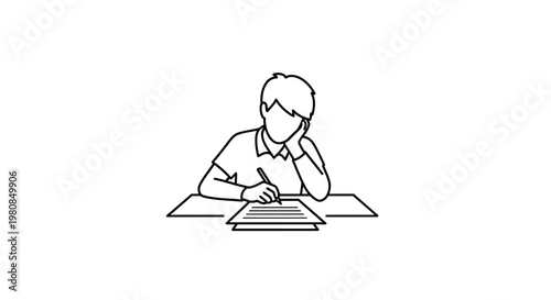 Boy writing on a notebook.