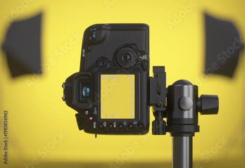 Camera rotated vertically, pointing at a yellow photography studio. Close-up of the screen. 3D render.