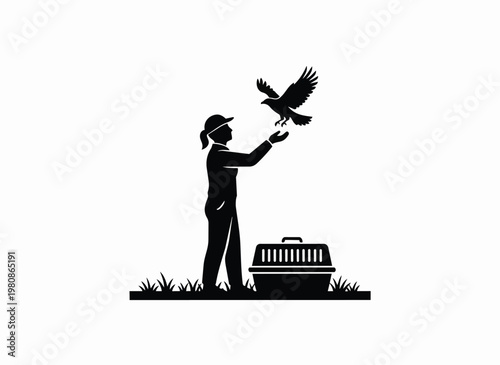 Woman releasing bird of prey from cage with crate and grass on white background.