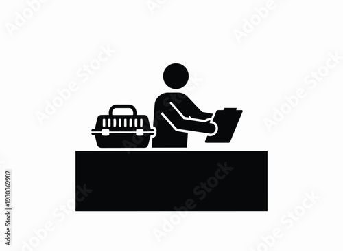 Person at reception desk with pet carrier, filling out forms for animal registration.