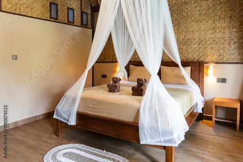 Canvastavla Relaxing bedroom interior with a draped canopy bed and decorative towels