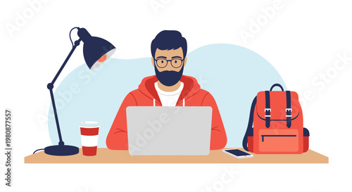 Man working on laptop at desk.