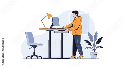 Man standing at a height adjustable desk working on computer, modern home office