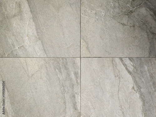 High-resolution gray stone tile texture with natural marble veins and grainy cement finish, professional floor and wall background for architectural 3D mockup, interior design, and industrial backdrop