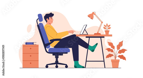 Man working on laptop at desk, home office setup, comfortable workspace