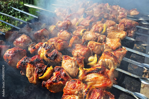 Grilled meat skewers on charcoal