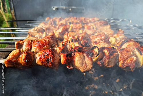Grilled pork skewers on barbecue