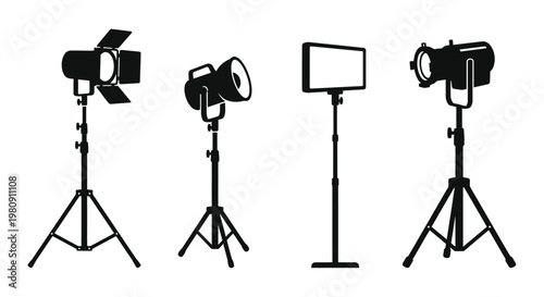 A collection of stage lighting fixtures on stands shown in silhouette
