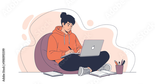 Young person studying on laptop, sitting on beanbag, creative workspace