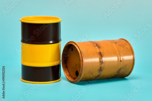 Two Cylindrical Barrels on Blue Background