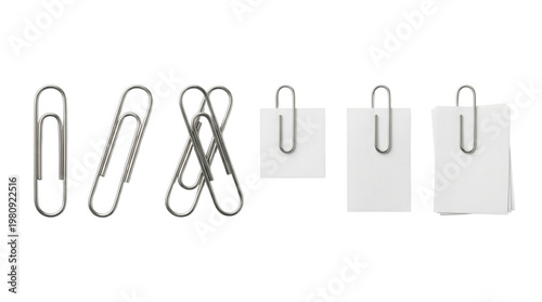 Paper clips and blank note paper on black background arranged neatly for office stationery concepts
