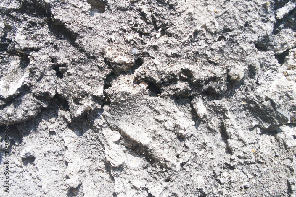 Fototapeta premium rough stone texture or cracked concrete.