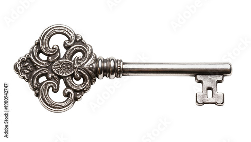 Isolated beautiful ornate antique silver key, vintage decorative metal object representing access and history