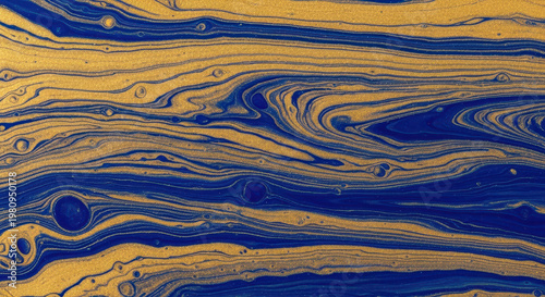Abstract fluid dynamics with swirling blue and gold patterns