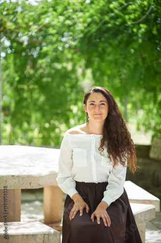 Portrait of a young beautiful brunette woman against the backdrop of the nature of northern Israel