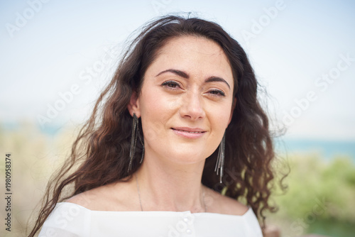 Portrait of a young beautiful brunette woman against the backdrop of the nature of northern Israel