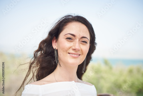 Portrait of a young beautiful brunette woman against the backdrop of the nature of northern Israel