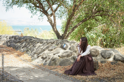 Portrait of a young beautiful brunette woman against the backdrop of the nature of northern Israel