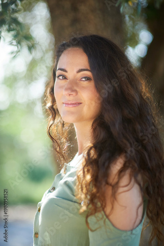 Portrait of a young beautiful brunette woman against the backdrop of the nature of northern Israel