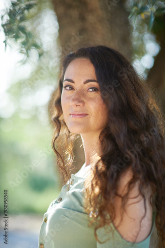 Portrait of a young beautiful brunette woman against the backdrop of the nature of northern Israel