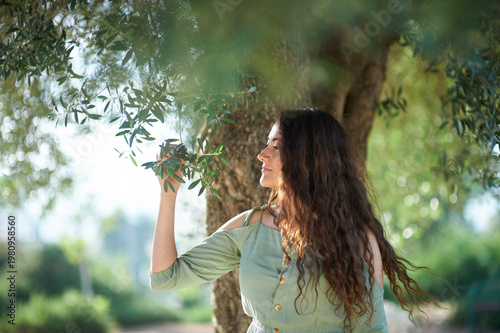 Portrait of a young beautiful brunette woman against the backdrop of the nature of northern Israel