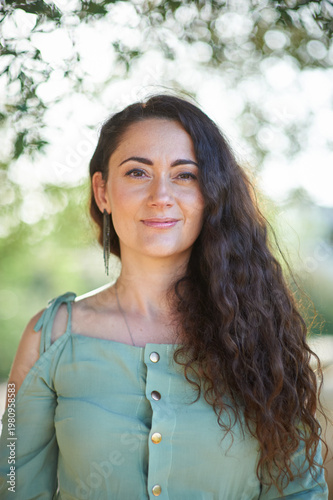 Portrait of a young beautiful brunette woman against the backdrop of the nature of northern Israel