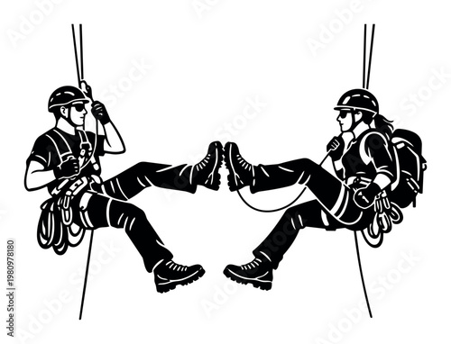 Two people rappelling, a man and a woman, demonstrating adventure sport, teamwork, and outdoor activity