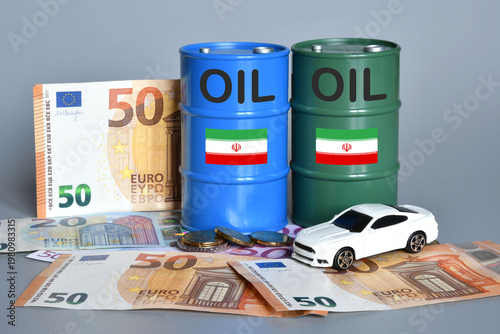 Miniature oil barrels with a car and Euro banknotes. Concept of shortage and rising fuel prices due to the Middle East crisis and the war in Iran.