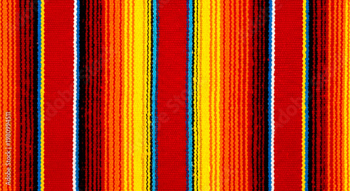 Vibrant Red and Yellow Striped Traditional Mexican Serape Fabric Texture Background