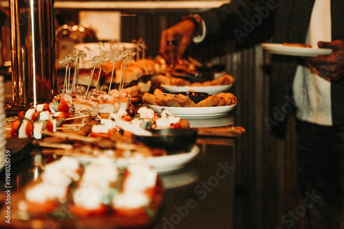 Obraz na płótnie Luxury buffet spread with gourmet appetizers and sliders at corporate event