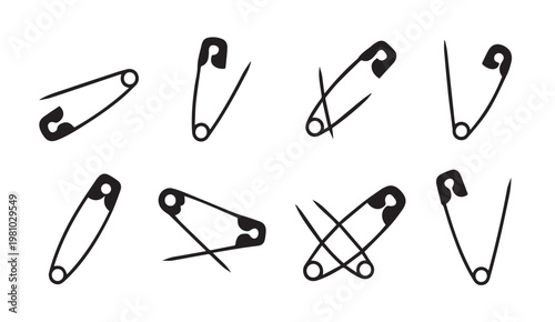 Assorted safety pins in various open and closed positions against a clean white background