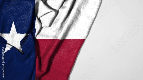 Close-Up Of TEXAS Flag With Blue Square, White Star, And Red Stripes Twisting Dramatically Texture