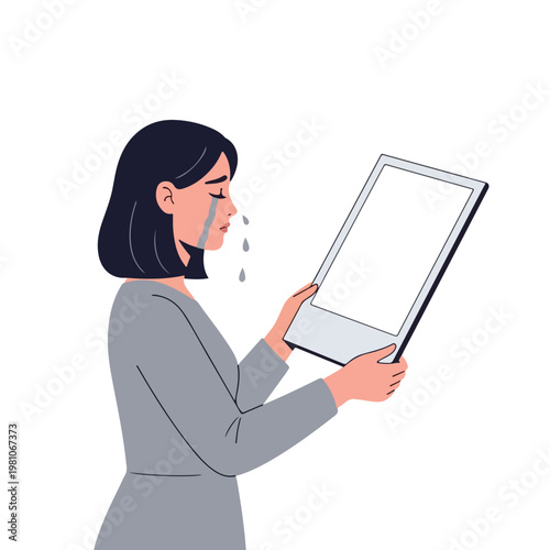 Sad woman holding a blank photo frame while crying, representing grief and loss