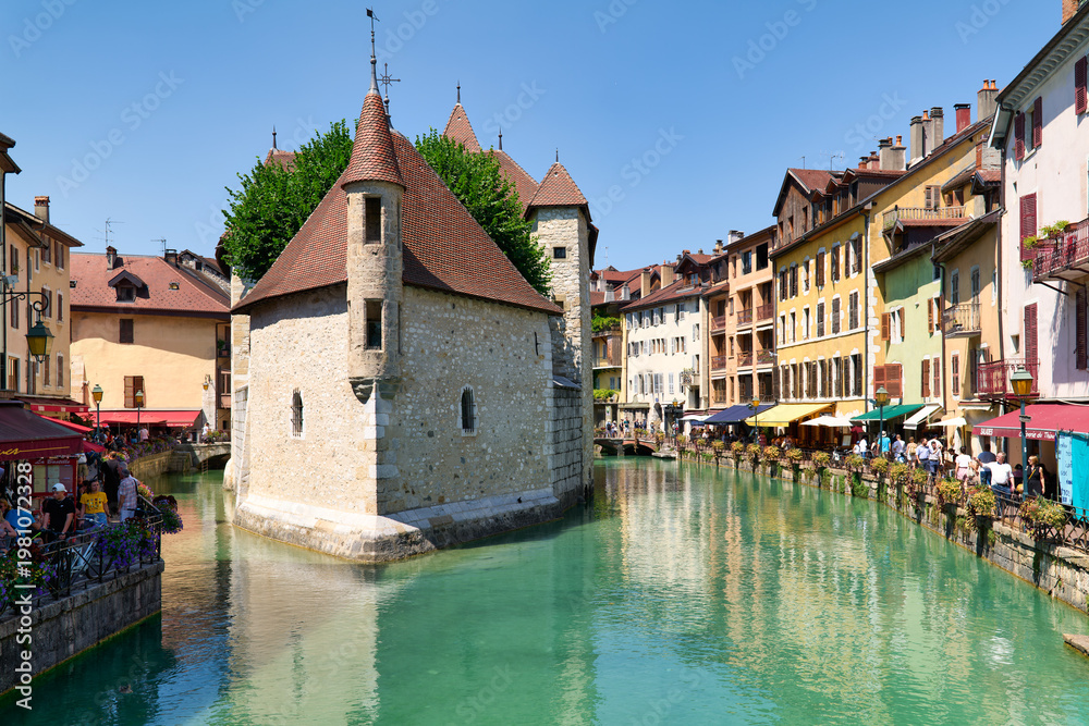 Fototapeta premium Exploring the Palais de l'Isle by the Thiou River in Annecy