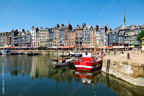 Fotografija Harbour scene in Honfleur Normandy with boats and buildings