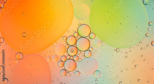 Oil droplets on water surface with rainbow colors bubbles