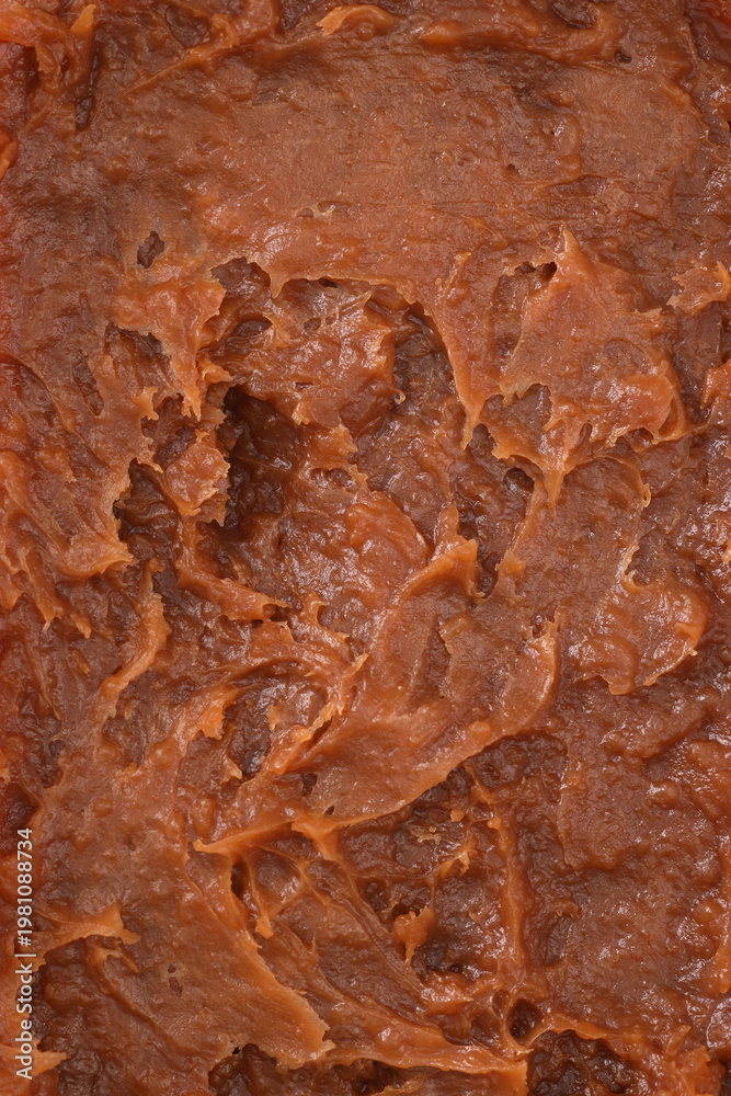 Fototapeta premium salt caramel paste texture, caramel spreadable cream close up, caramel spread