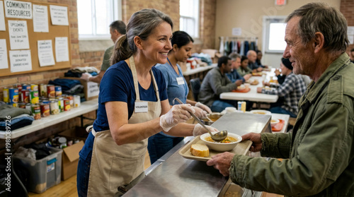 Compassionate volunteer serves warm meal of soup and bread to grateful recipient at community soup kitchen, surrounded by supplies and other patrons enjoying their food in supportive atmosphere.