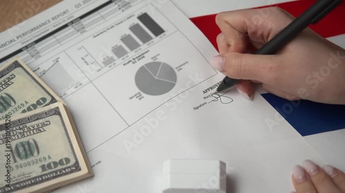 Dutch CFO signs internal financial report featuring profit charts first then brands purple approved seal ratifying international company strategies.