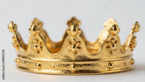 A golden crown with intricate designs or A luxurious gold royal headpiece or An exquisite gold thronelike