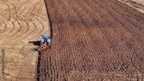 The tractor is performing spring plowing