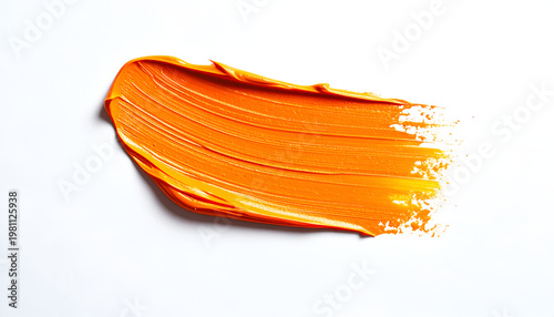 A vibrant orange paint stroke is dramatically displayed against a stark white background, showcasing the texture and movement of the artistic medium.