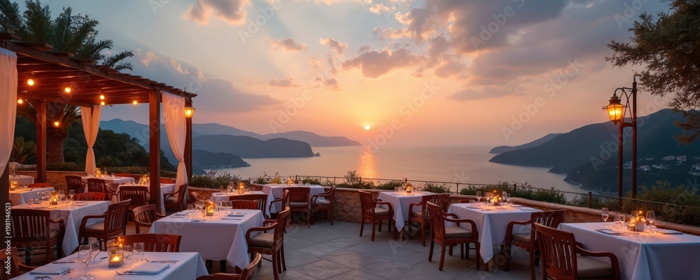Fototapeta premium Restaurant terrace with tables set for dining overlooks calm sea at sunset. Evening lights glow on pergolas and lamps. Mountain islands are silhouetted against warm sky.