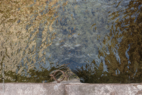 water impressions of Lac d´Annecy, France, with stone wall in front